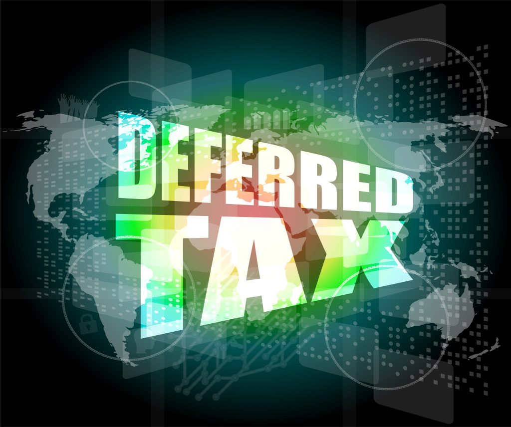 deferred tax words on digital screen with world map