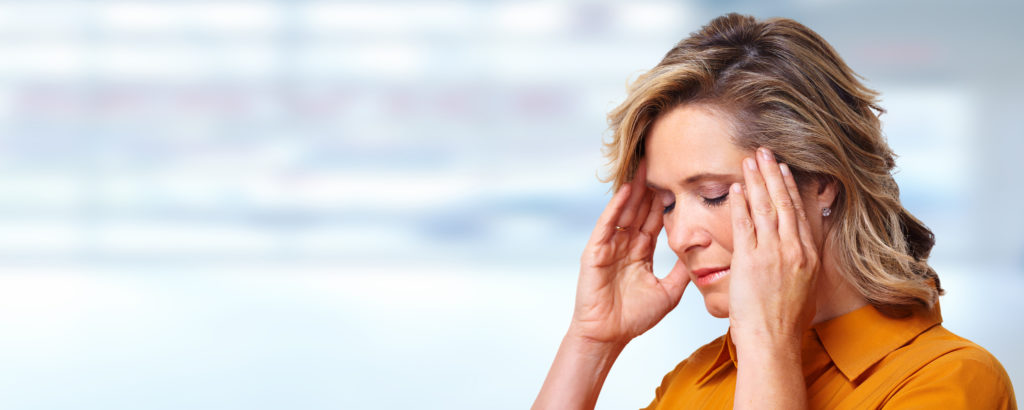 Woman having headache migraine. Stress and depression.